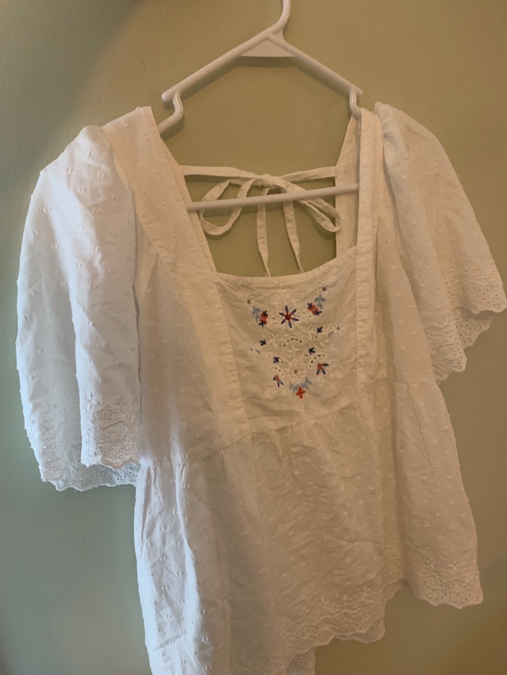 Embroidered eyelet smocked peasant blouse